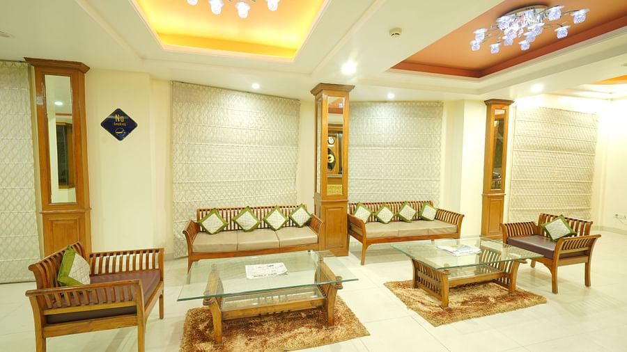 A lobby area with cushioned sofas and chairs arranged for seating at DLS Hotels The Rock Castle.